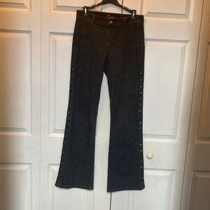Cache Jeans..  size 6 Has Stylish Snaps on each side. Flare leg